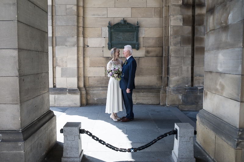 Bride and groom and Edinburgh Pillars