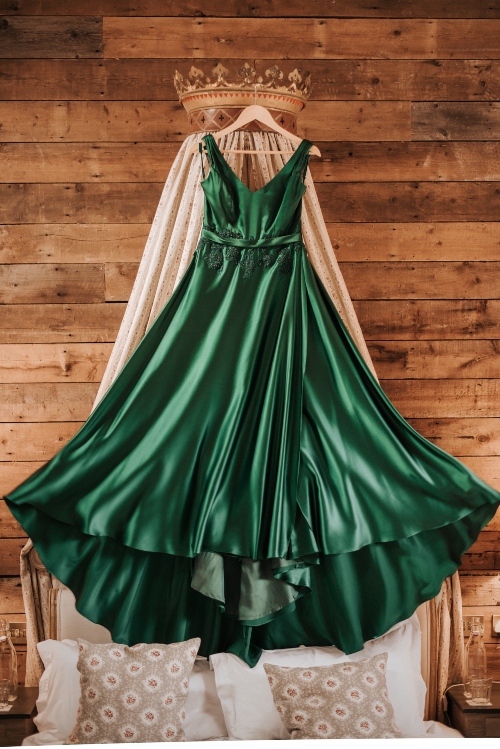 Green silk dress with satin belt and beaded lace