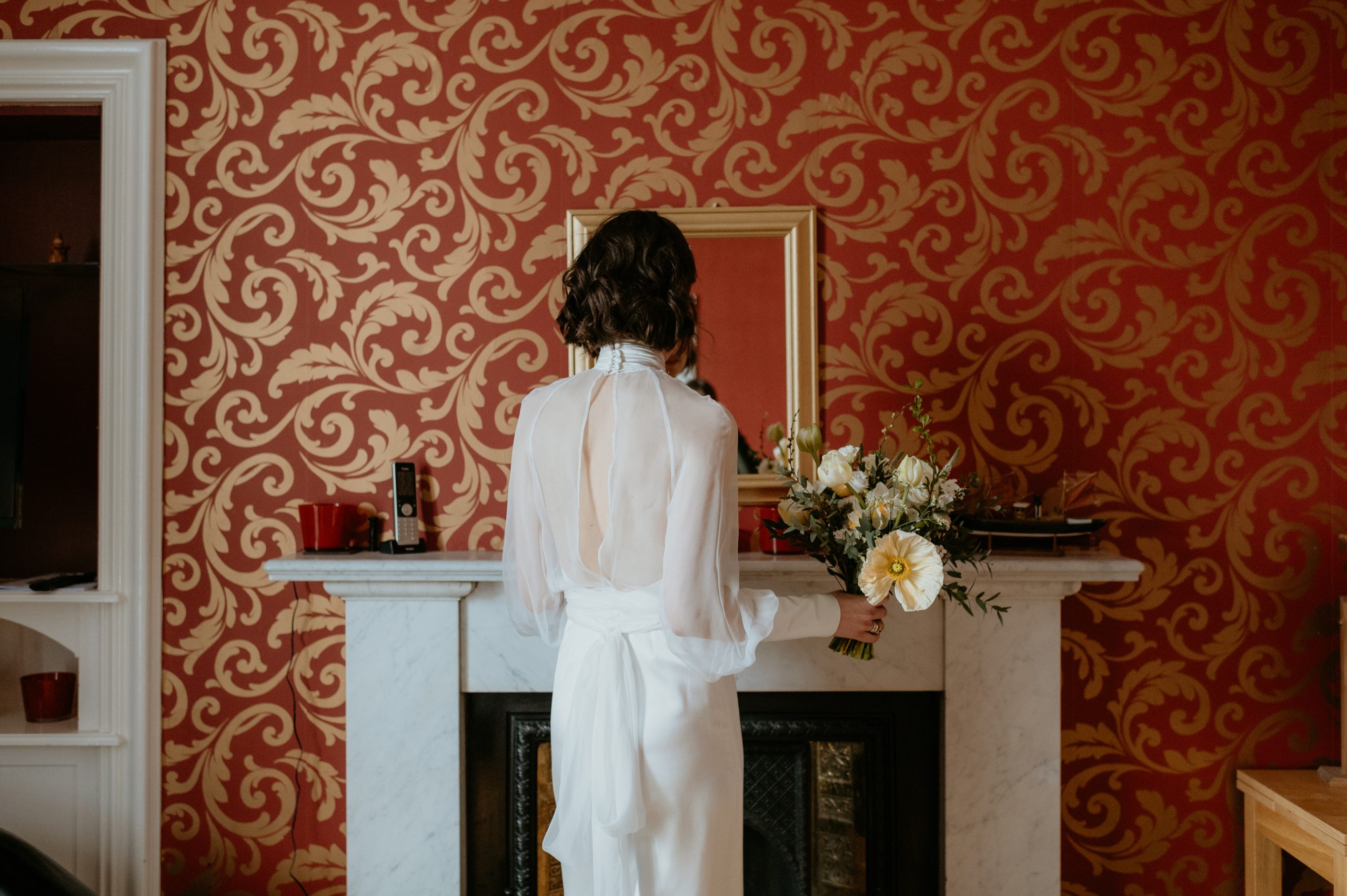 bride in jumpsuit and silk chiffon jacket