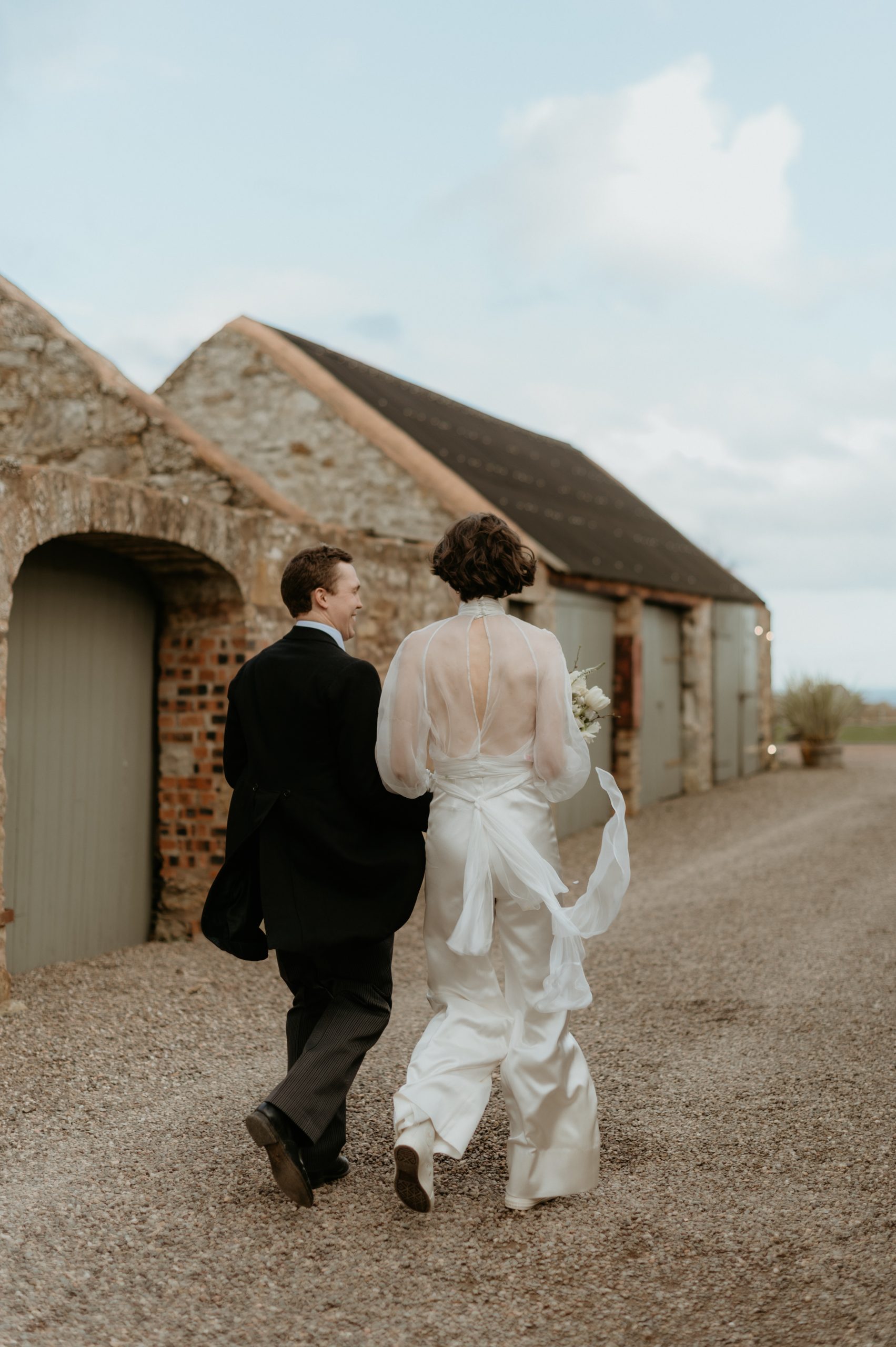 bride and groom at cowshed crail