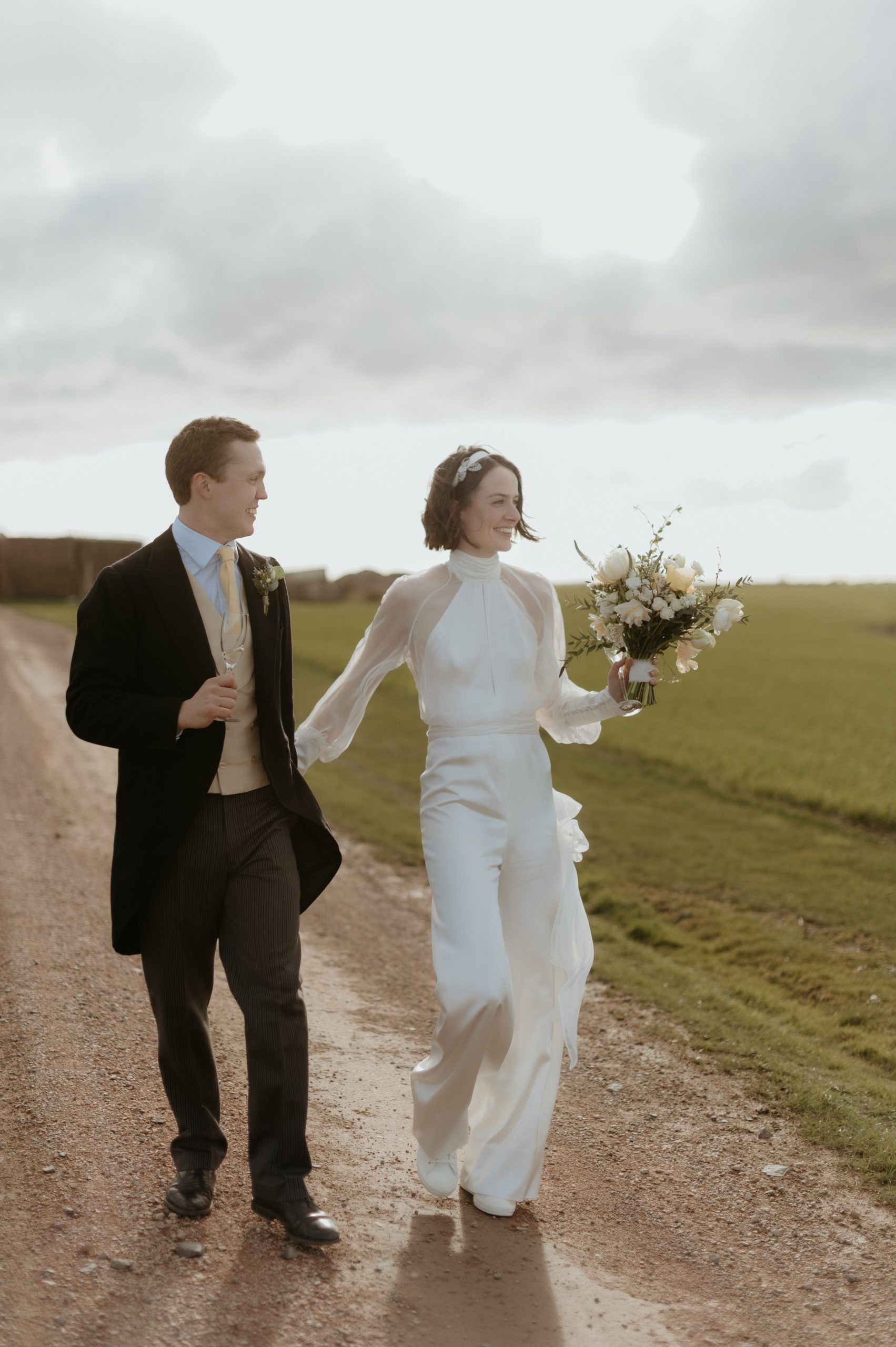 bride in jumpsuit and groom