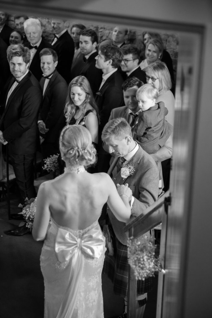 bride and her dad arriving at wedding