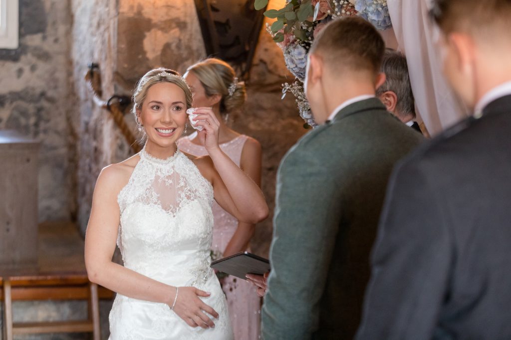 bride in beaded lace halter neck dress