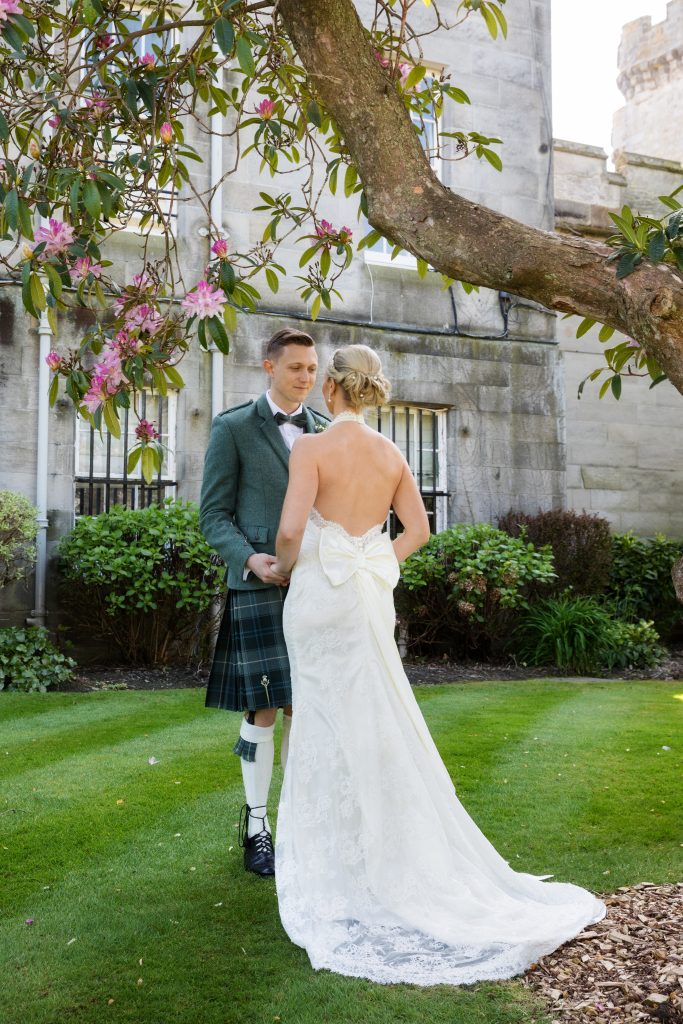 bride in low back dress with groom