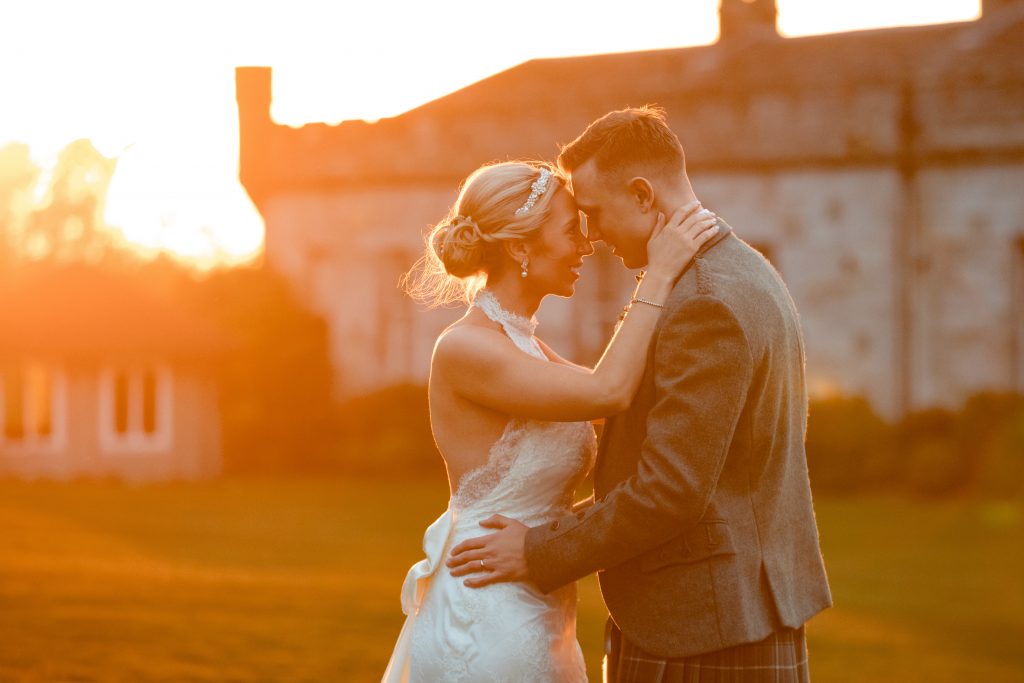 bride and groom in the sunset