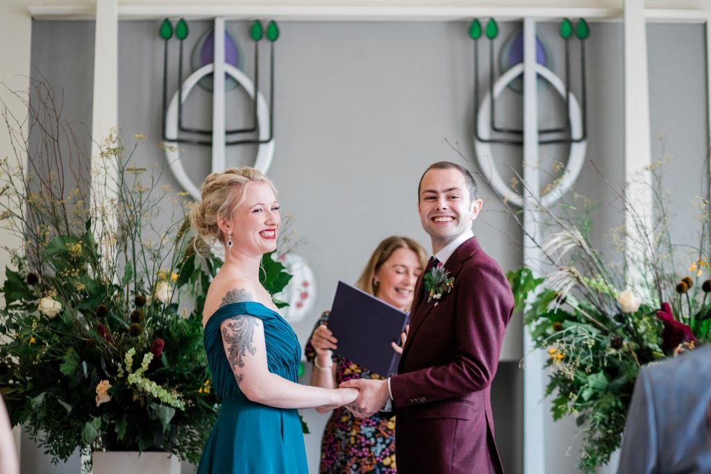 teal dress at colourful wedding