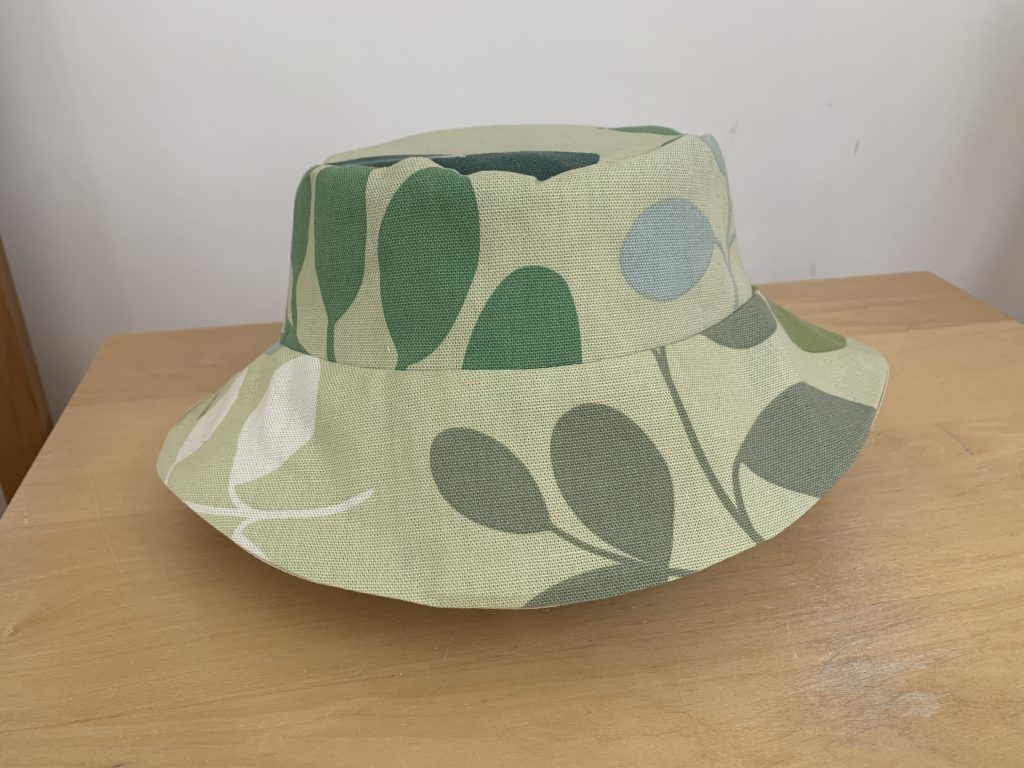 green patterned sun hat or bucket hat