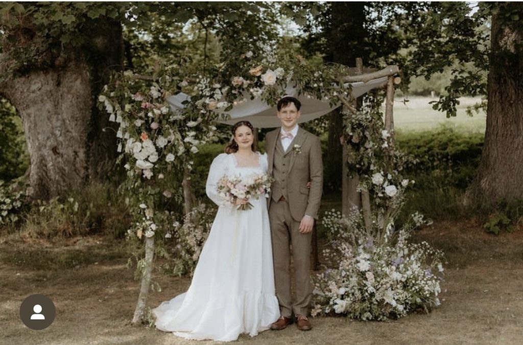 bride and groom and Chuppah