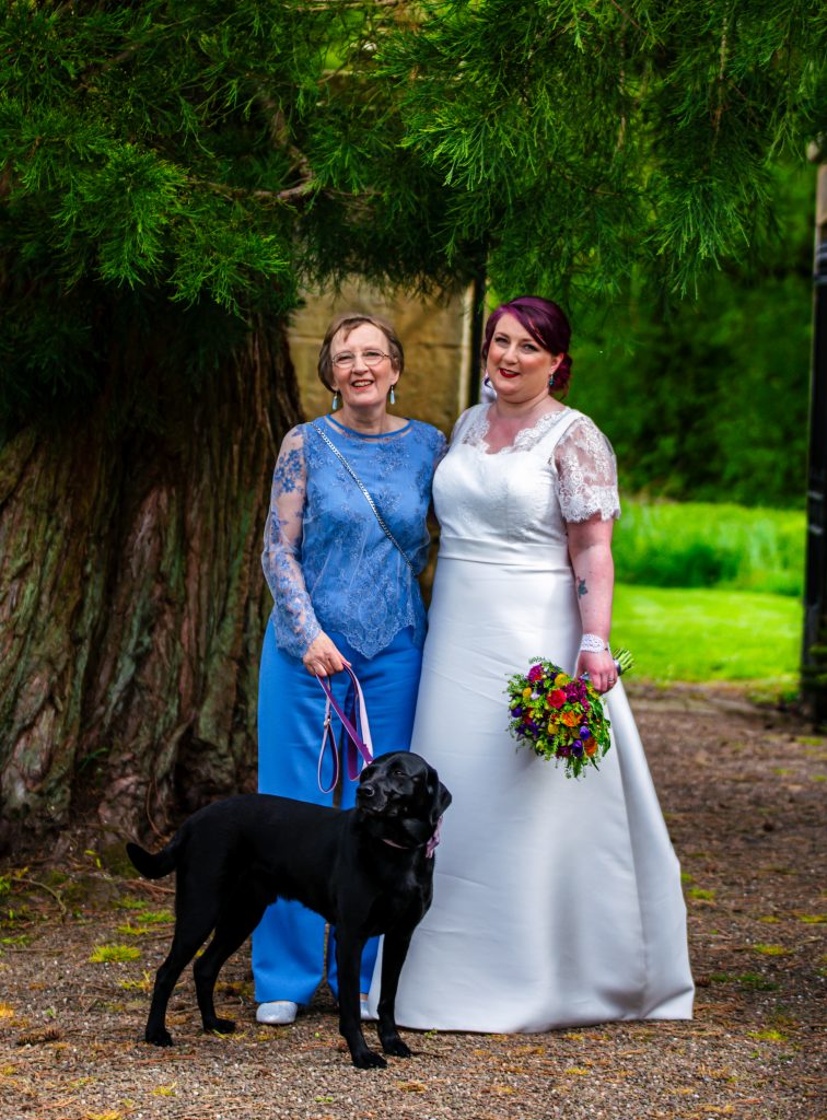 Bride and mother of the bride in bespoke dresses